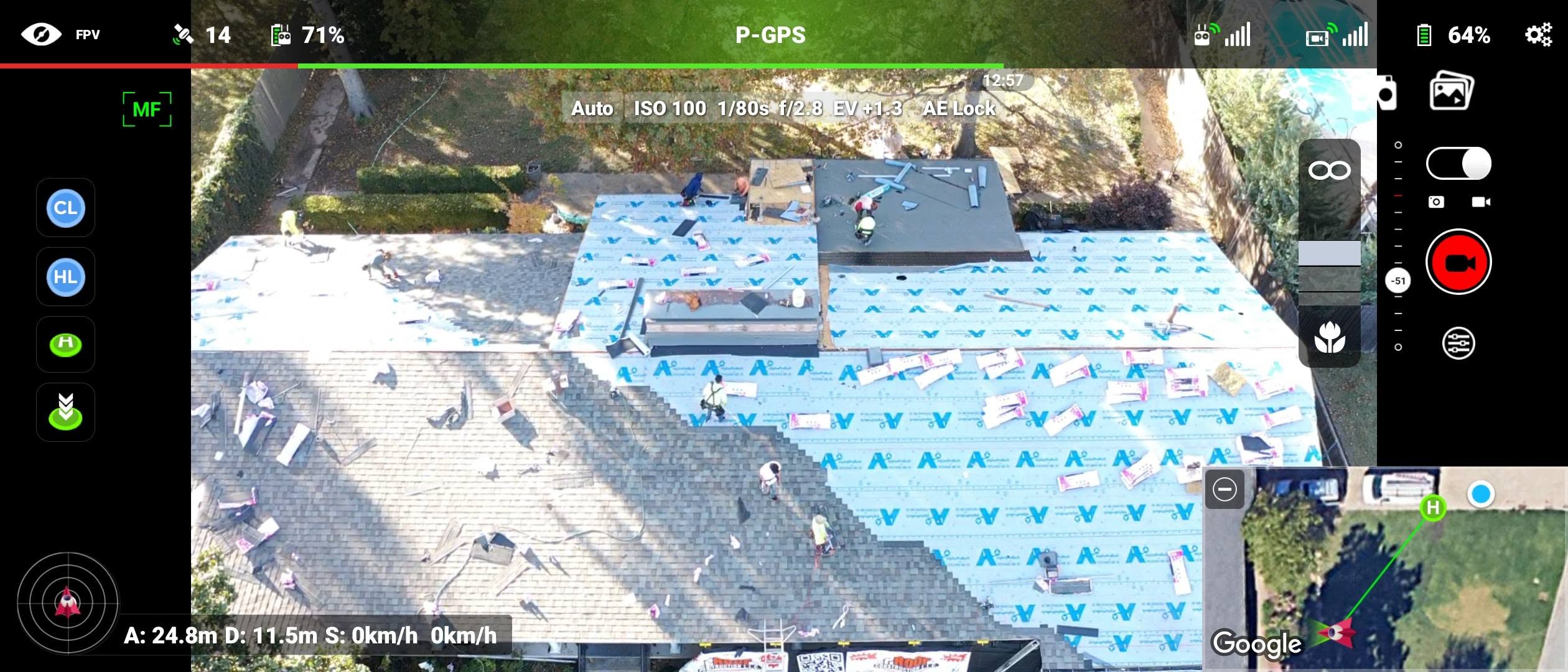 Drone view of roofers working on a house, with a map showing the drone's location.